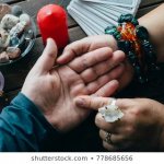 palmistry-fortune-teller-reads-lines-260nw-778685656 (1)